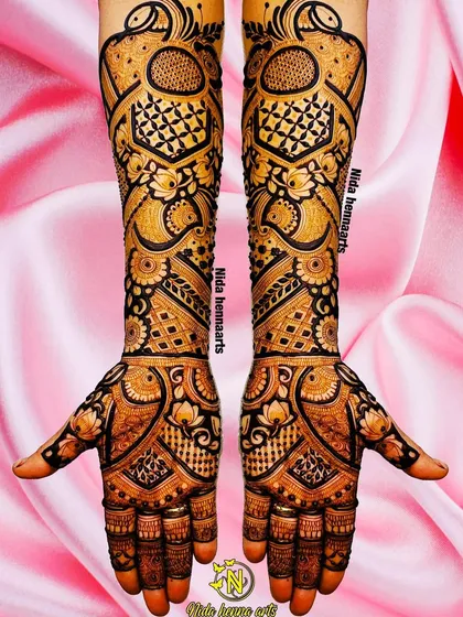 This heavy Indian bridal design is an example of my passion for detailed work. It features multiple layers of patterns, including peacocks and floral elements, for a truly grand statement.
