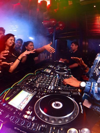 Reaching out to the crowd. It's a two-way street; their energy fuels my performance, and my music fuels their night.