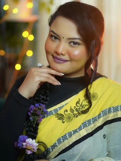 A portrait from my self-makeup session promotion, showcasing a soft glam look with a beautiful floral braid.