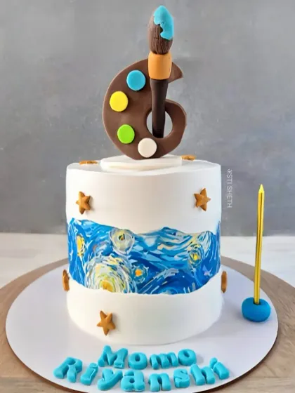 An art-themed cake inspired by Van Gogh's "Starry Night." The edible print is paired with a chocolate paint palette and brush topper for a 6th birthday.