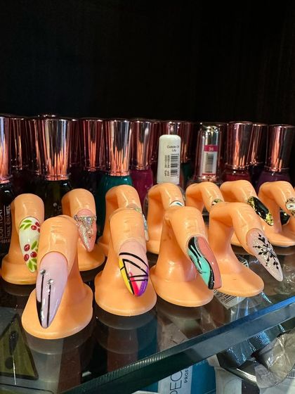 More of our pre-made nail art designs, from geometric patterns to delicate florals. These displays help you visualize the possibilities and choose a style you love.