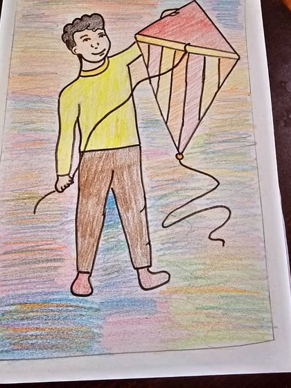 A simple and sweet drawing of a boy flying a kite, created by one of my young students. We encourage kids to draw scenes from their life and imagination using colored pencils.