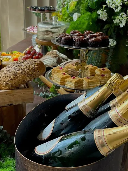 Bottles of premium champagne on ice, ready to be popped for a celebratory toast. A key element of our luxury brunch experience.