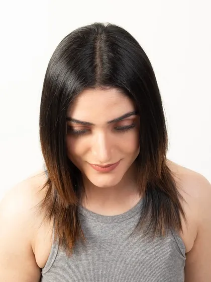 A top-down view of the model's hair with the topper applied, proving its seamless integration and natural appearance.