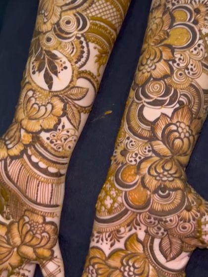 A side-by-side view of two different but complementary bridal designs. Both feature heavy floral work, showcasing my versatility in creating unique patterns for the wedding party.