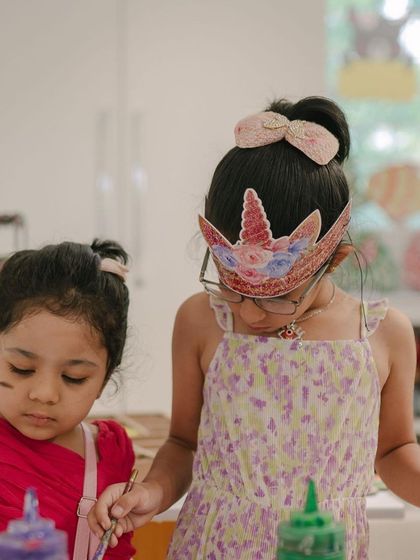 The best parties are the ones where you get to be creative! These two young guests are having a blast painting together, with one even sporting a unicorn crown she made. I provide everything needed for a fun and imaginative celebration.