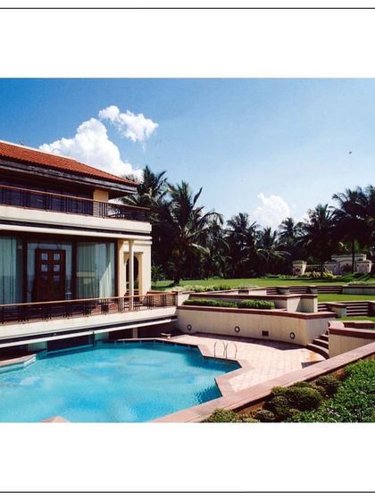 The ultimate luxury of villa living in our stunning sea-facing project in Daman. This view shows the multi-level design with a serene pool and lush landscaping, crafted with passion and precision.