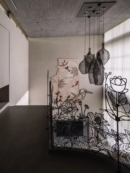This is where art becomes an integral part of the architecture. This custom metal railing for a villa in Ahmedabad is a functional sculpture, with intricate, laser-cut silhouettes of local flora and fauna that create a dynamic play of light and shadow along the corridor.