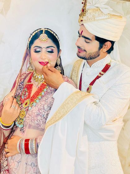 A sweet moment between the bride and groom. I provide rental options for both, ensuring a perfectly coordinated look for the couple on their special day.