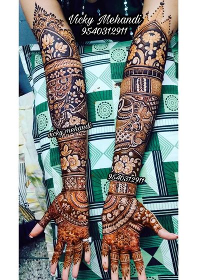 A gorgeous full-arm design done by my team, featuring a mix of floral, paisley, and geometric patterns for a rich, traditional look.