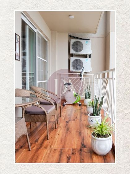 This balcony was transformed into a cozy outdoor retreat. I used warm wood-look flooring, comfortable wicker chairs, and plenty of potted plants to create a small urban oasis.