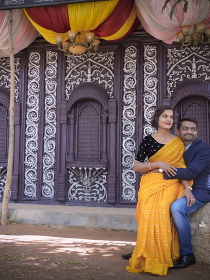 The intricate details of this traditional Chettinad-style doorway provide a rich and cultural backdrop for this couple's portrait.