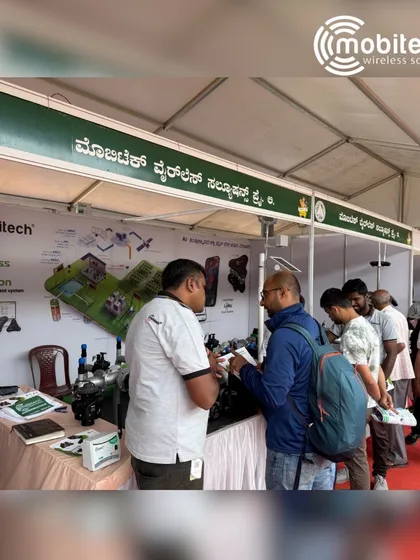 Our team member explaining the benefits of our system to a visitor at Krishi Mela.
