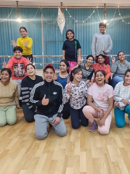 A happy, tired, and super-proud group after an amazing class. This is the 'Aura' vibe we cherish, a supportive space where kids and adults cheer each other on. Look at those happy faces, that’s the best review we could ask for.