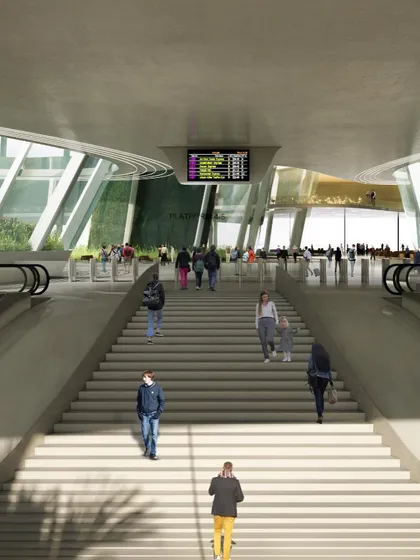 Passengers ascending the main staircase, a central feature of the station's circulation design.