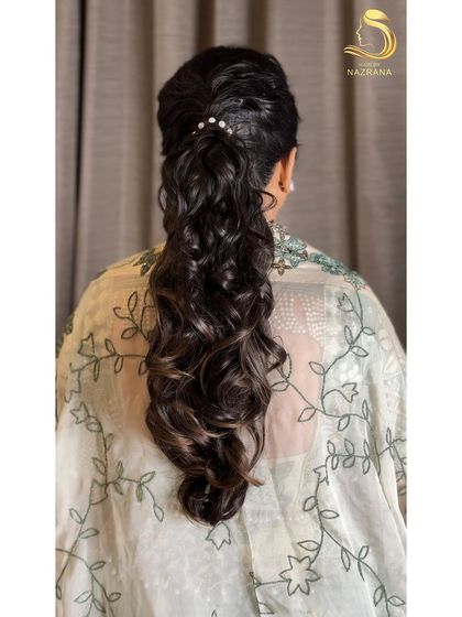 A close-up of the messy, textured ponytail from the back.