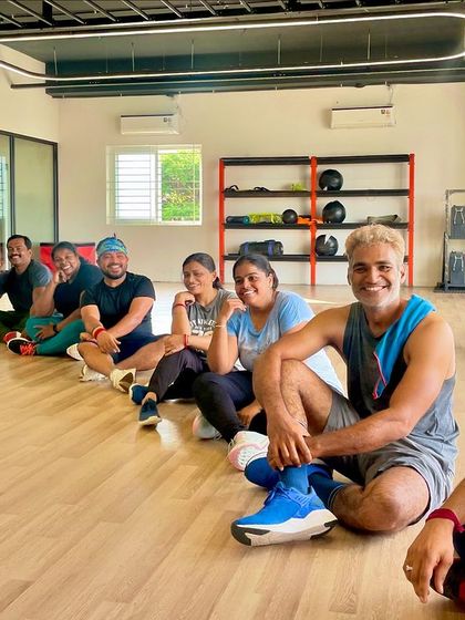 Taking a well-deserved rest on the floor after a fun-filled Zumba session. Even when we're tired, we're smiling.