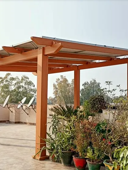 The Atrium solar pergola provides a beautiful setting for a terrace garden, blending clean energy generation with natural aesthetics.