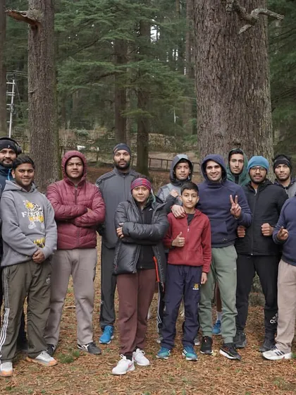 The full group after a refreshing yoga session in the woods. This is how we stretch, recover, and prepare our bodies for the next day's work.