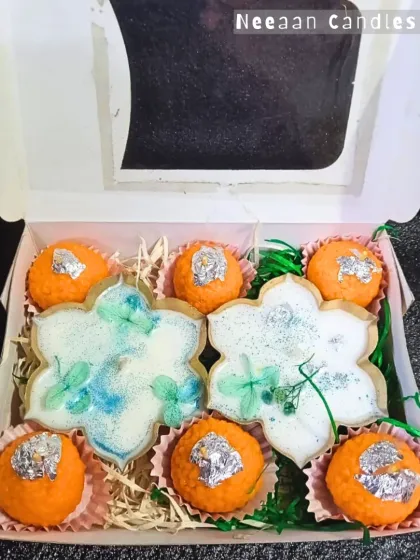 A hamper that's as sweet as your bond. This gift box combines our floral urli candles with our popular laddu candles for a unique Rakhi gift.
