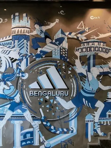 For the new Adidas store in Bangalore, we created a dynamic mural that captures the city's spirit and the brand's energy. This custom wall art blends local Bengaluru landmarks with the motion of sport, creating a powerful statement piece for the retail space.