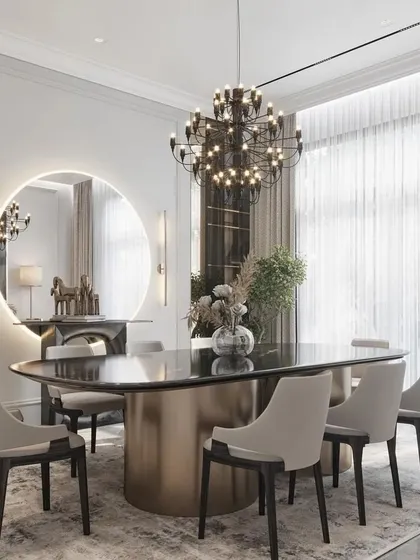 A different angle of the sophisticated dining room, highlighting the sheer curtains that allow for soft, diffused natural light. The reflection in the mirror shows the careful placement of lighting and decor.
