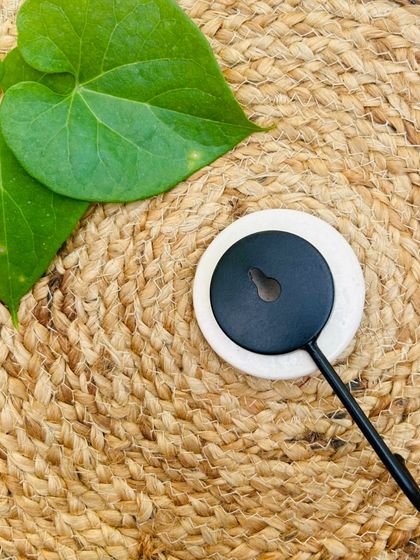 A close-up of the back of our ceramic wall hooks. These hooks are designed to be securely mounted on drilled nails or screws, ensuring they can hold the weight of our macrame plant hangers and shelves.