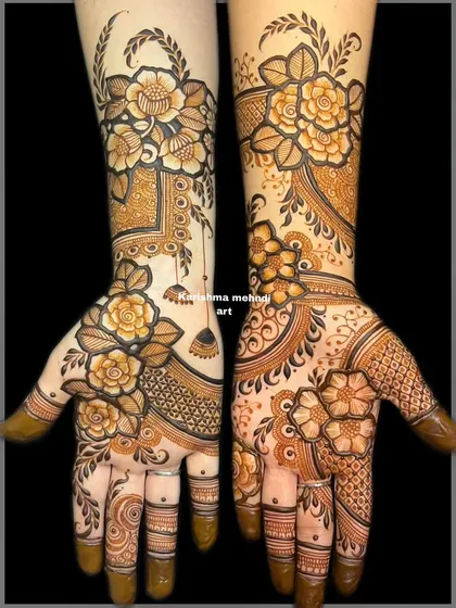 The full view of the asymmetrical floral design. This image clearly shows how the two different styles on each hand create a unique and personalized bridal look.