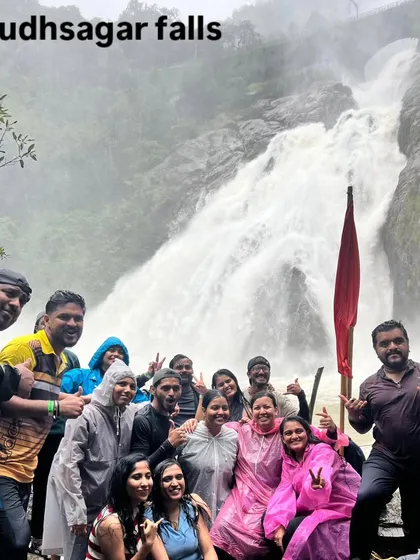 Another happy group at Dudhsagar falls, posing with our flag. The energy here is always incredible, especially during the peak monsoon season.