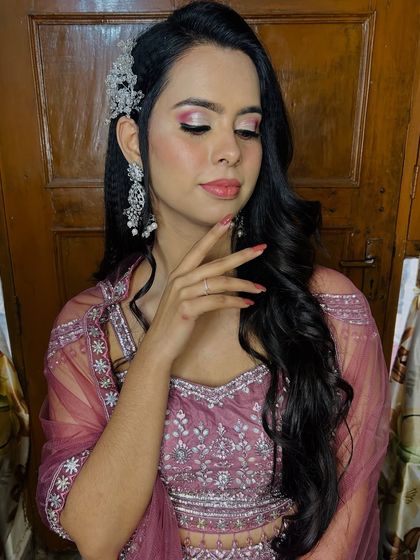 A glamorous look for a sangeet or cocktail party, featuring pink and silver cut-crease eyeshadow.