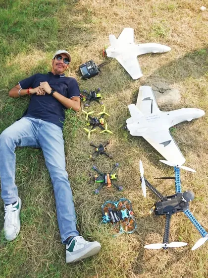 When she asks about your body count. A fun shot of me lying on the grass surrounded by my fleet of drones and RC planes.