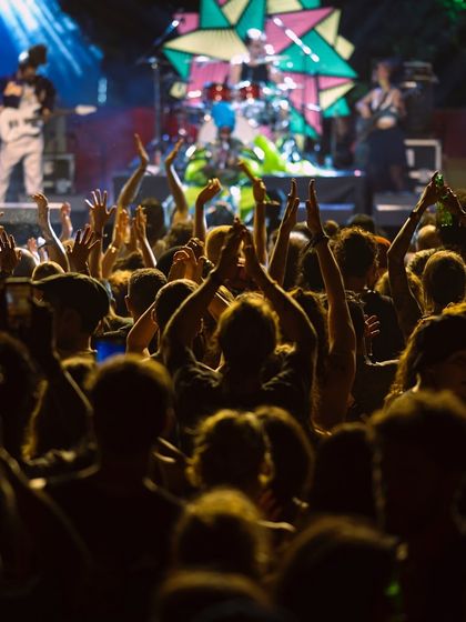 The crowd's hands are in the air as the sun sets at a festival. There's nothing like playing for a huge audience and feeling that collective energy.