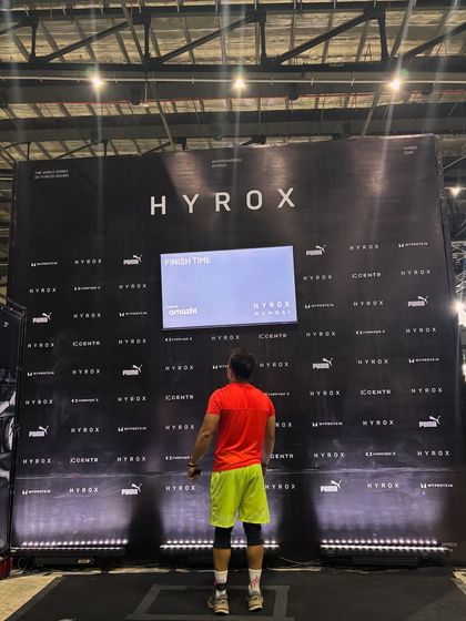 Staring down the finisher wall at Hyrox Mumbai. A moment of reflection after pushing my body to its limits. This is what we train for.