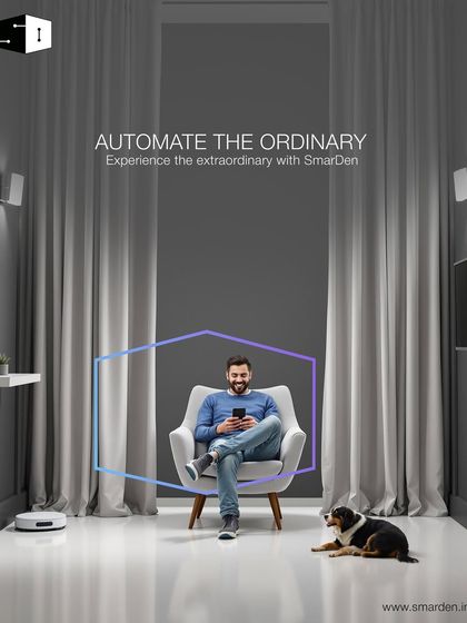 Automate the ordinary, experience the extraordinary. Here, a user relaxes with his dog, controlling his entire environment, from the lights to the robot vacuum, all from his phone.