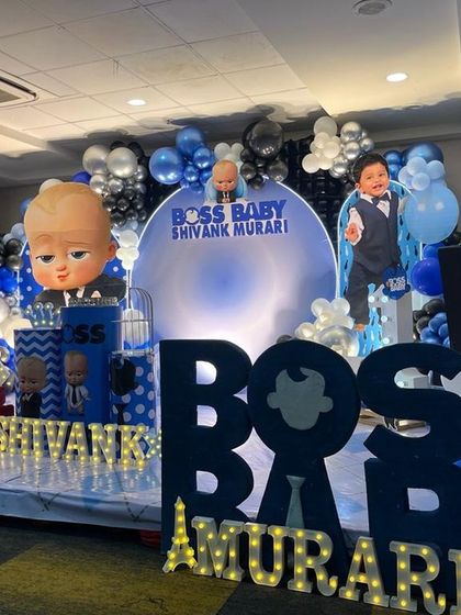 A wide view of the Boss Baby stage setup, showcasing the large marquee letters and multiple character cutouts that make the theme immersive.