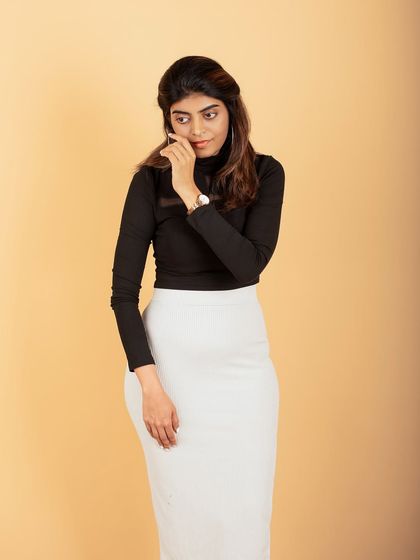 A candid and thoughtful pose during a studio session. I work to capture different moods and expressions to give you a variety of shots.