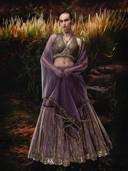 A cinematic fusion of a warm, projected landscape and a carefully lit model. This demonstrates how to balance the light on the subject with the background to create a cohesive, painterly fashion portrait.