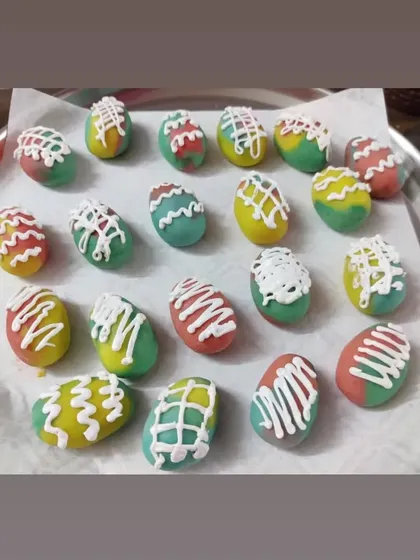 Another look at my decorated Easter egg cakesicles. The colorful base and white drizzle make them a cheerful addition to any Easter celebration.