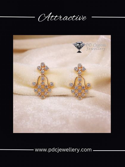 An attractive pair of 18kt hallmarked gold and diamond drop earrings. The design is reminiscent of a traditional 'jhumki' but with a modern, lightweight feel.