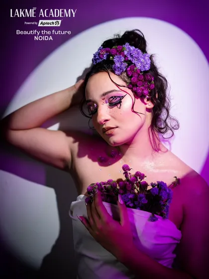 A creative portrait of the flower fairy. The use of dramatic lighting and shadows adds depth and mood to this fantasy look.