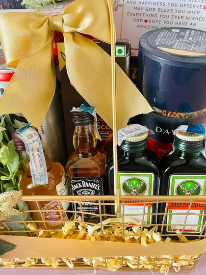 A close-up of the miniature Jack Daniel's and Jägermeister bottles in the metal basket hamper. I can source specific brands upon request.