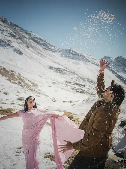 Capturing the pure, unscripted joy of a playful moment in the snow. This is for couples who want their pre-wedding shoot in Manali to be full of laughter and spontaneous fun.