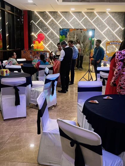 A wide shot of a party I catered, with my staff visible in the background ensuring everything runs smoothly. My team blends in professionally while providing top-notch service.