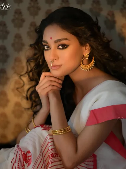 A gentle and serene portrait from the Noboborsho shoot. The model's soft expression and the classic styling evoke a sense of timeless Bengali beauty.