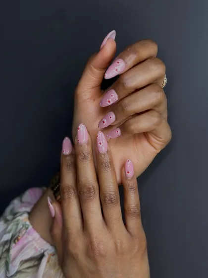 Our students turn every nail into a playful canvas. This simple yet chic design with delicate dots proves that art can be at your fingertips.