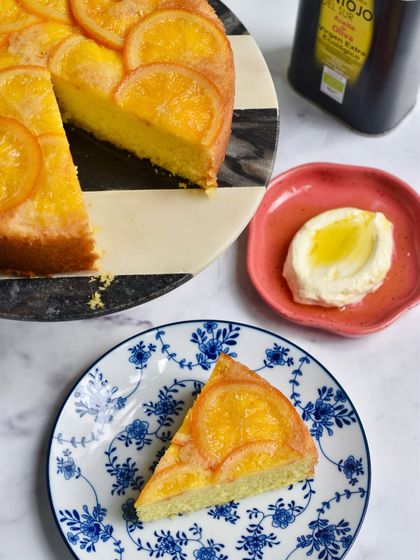 Our Olive Oil Orange Upside Down Cake is a classic Mediterranean dessert. It's moist, light, and has a beautiful caramelised orange topping.