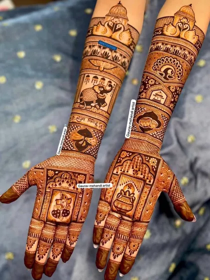 This grand design is filled with auspicious symbols, including Ganesha, a kalash, and elephants, making it perfect for a bride seeking blessings and beauty.