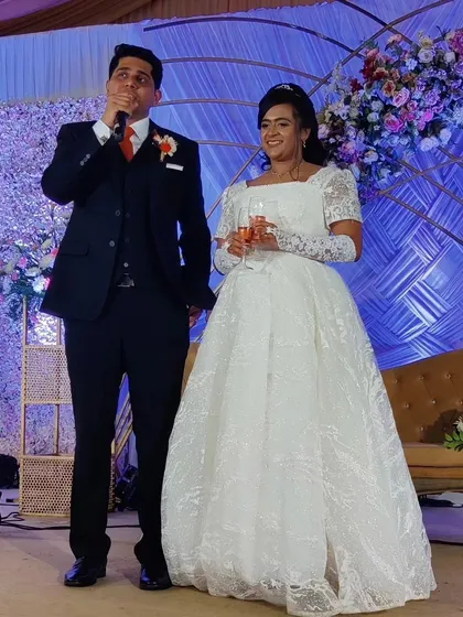 The groom delivers a heartfelt speech during the reception. As the emcee, I facilitate these moments, ensuring toasts and speeches flow smoothly and touch every heart in the room.