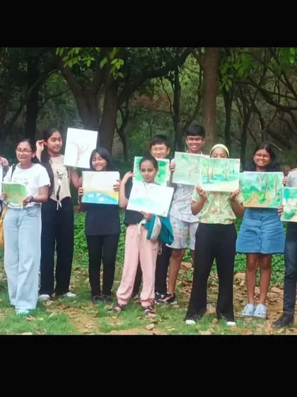 Learning isn't confined to four walls. Our students from the drawing class proudly showcase their beautiful landscape paintings created during an outdoor Nature Study Workshop, where they learned to observe and capture the world around them.