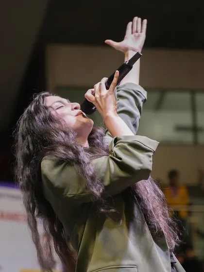 A powerful moment captured during my performance at the opening ceremony of the Delhi Olympic Games 2024. Singing at such a high-profile event was an electrifying experience.